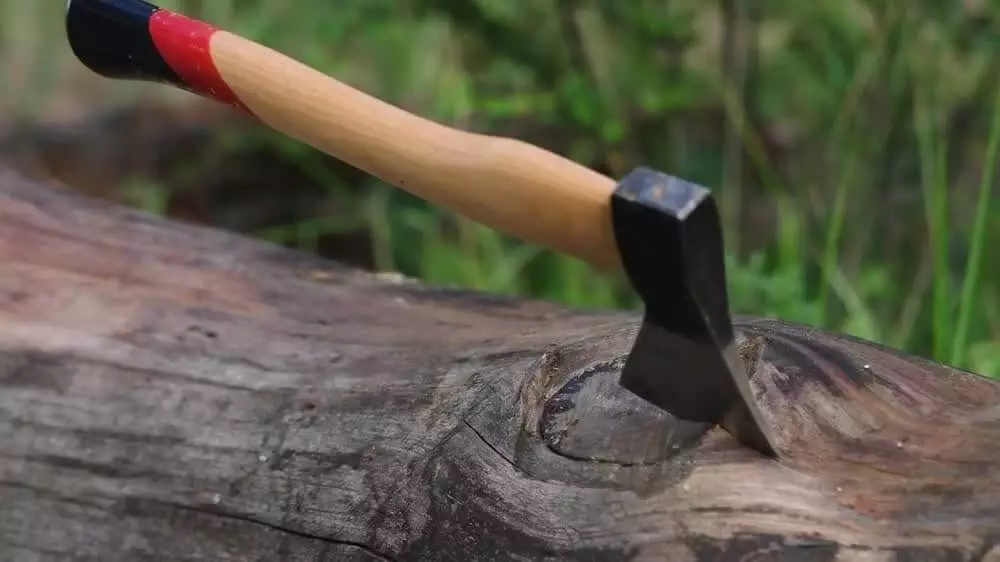 camping axe splitting wood