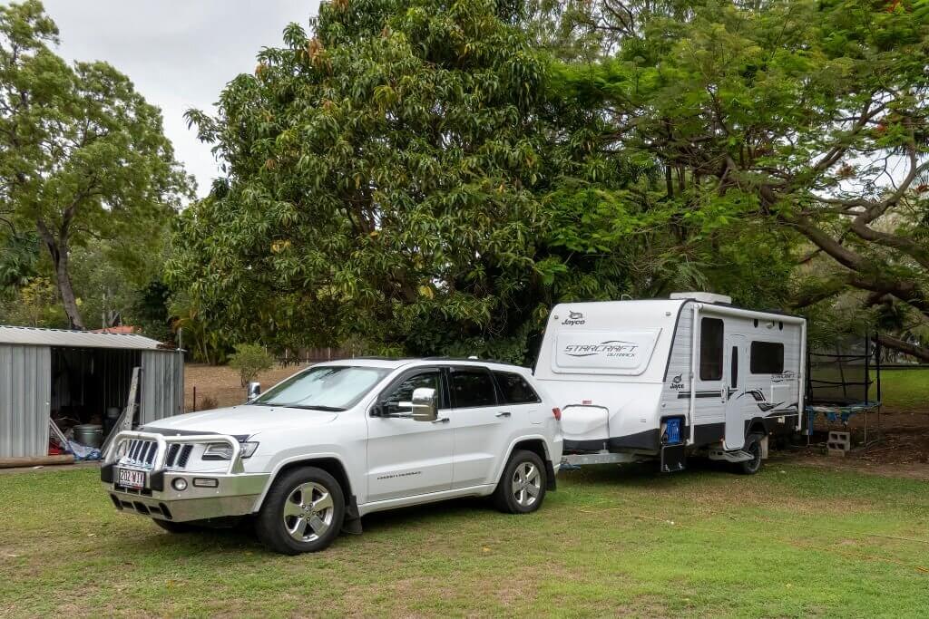 a camper packed in the shade