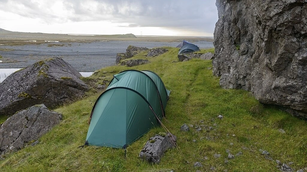 backpacking tent between rocks