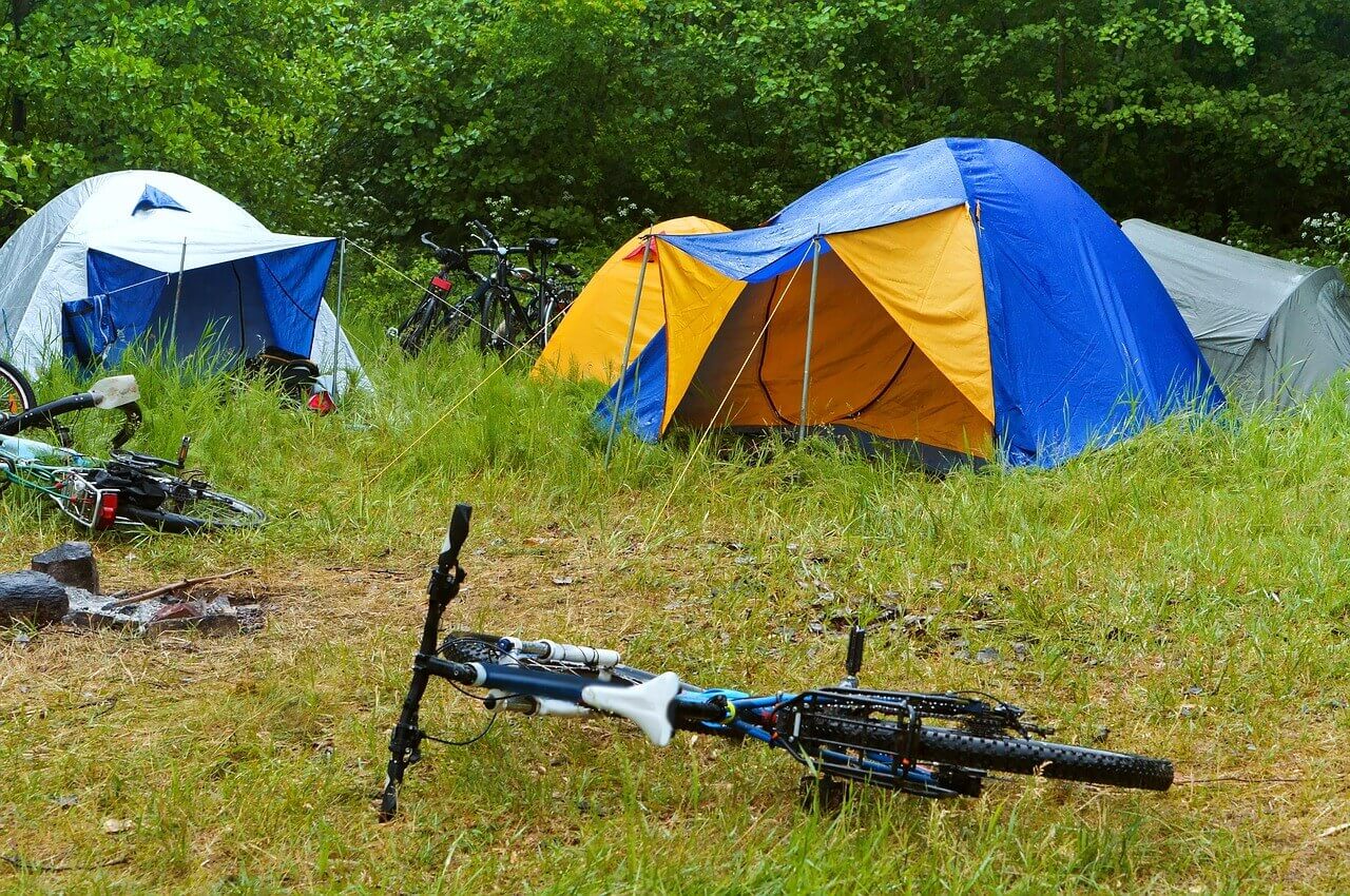 camping with a bicycle near a river