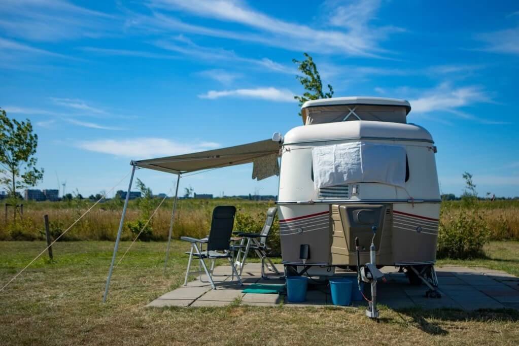 camper with a patio awning area shaded from the sun