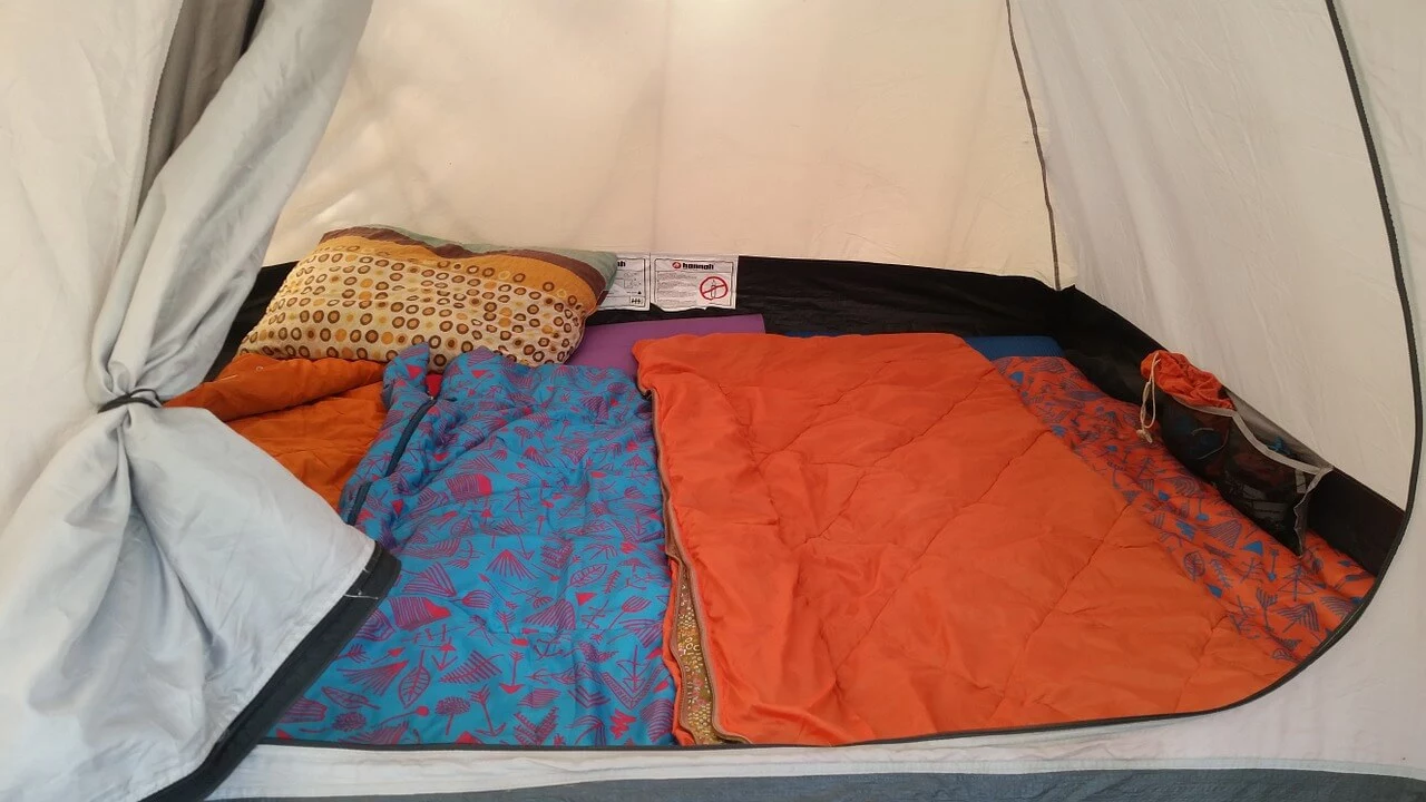 camping gear on top of tent footprint