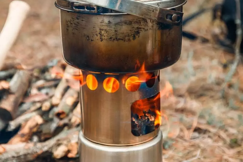 cookware on a burning wood camping stove