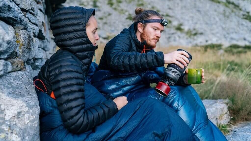 couple in a camping sleeping bag