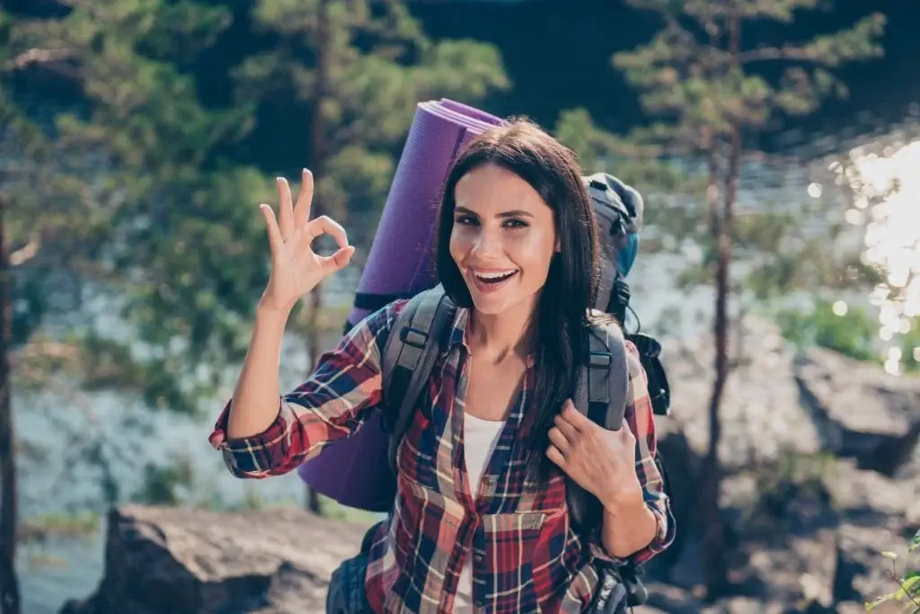 a female camper enjoying camping outside