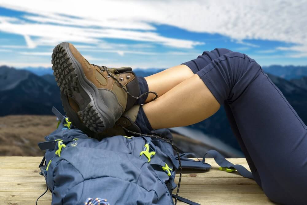 a woman hiker showing hiking boots