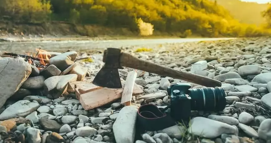 long wooden handle of a camping axe