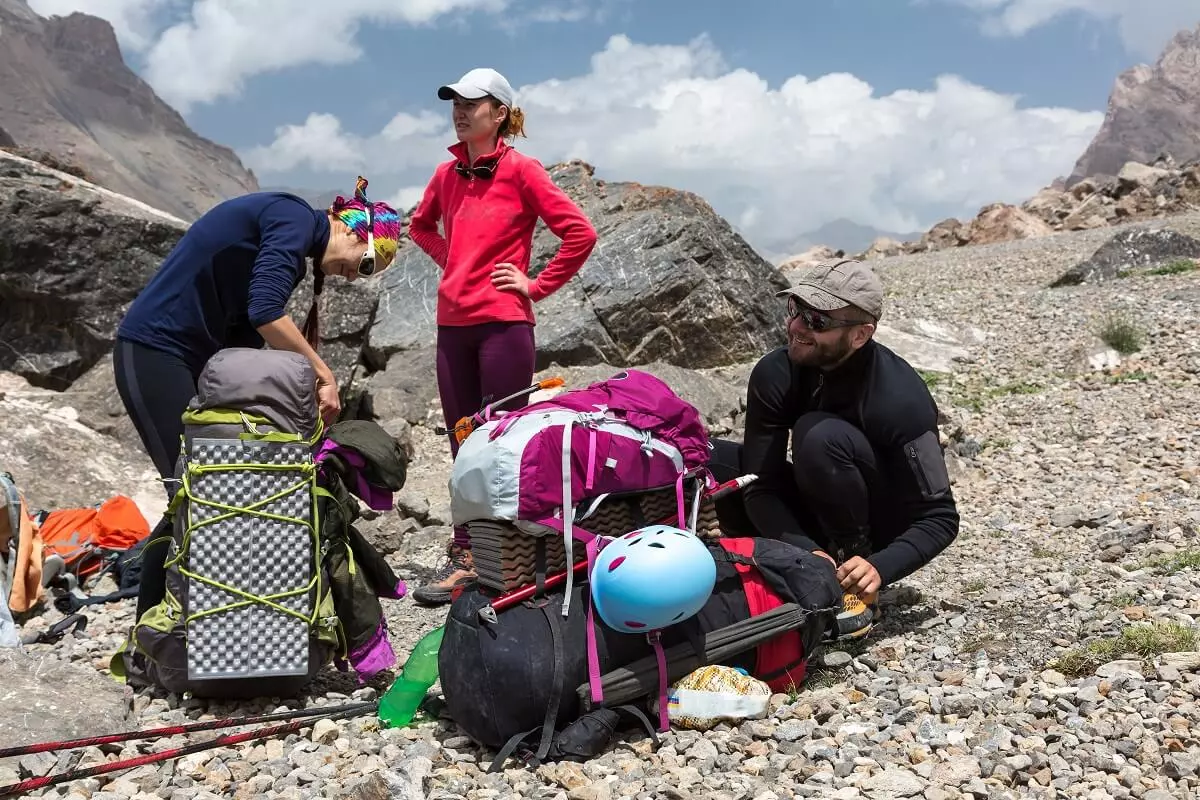 hikers packing their backpacks