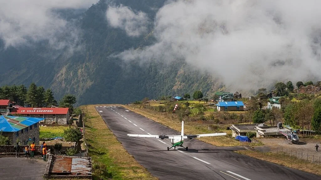 plane on a runway at Lukla Airport at the foot of Mount Everest