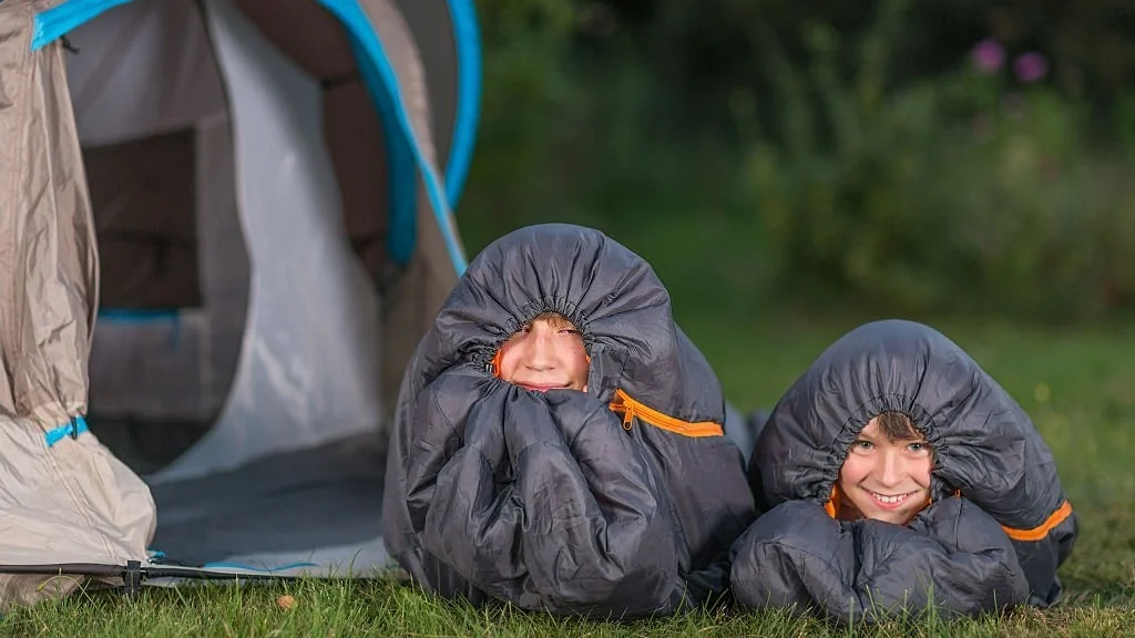 sleeping warm in sleeping bags while out camping