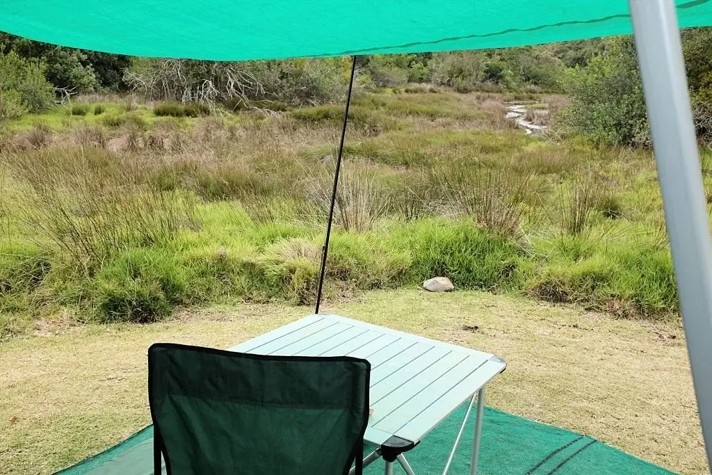 a lounging area made by useing a tarp