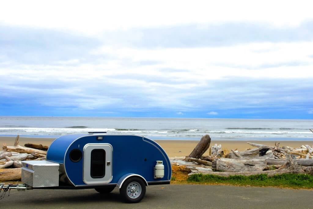 a teardrop trailer on the roadside