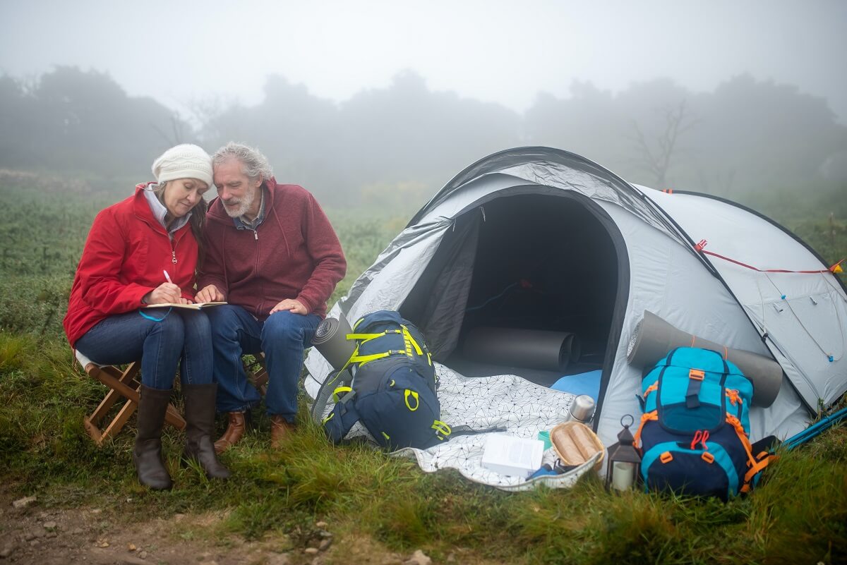 old people camping writing tent guide