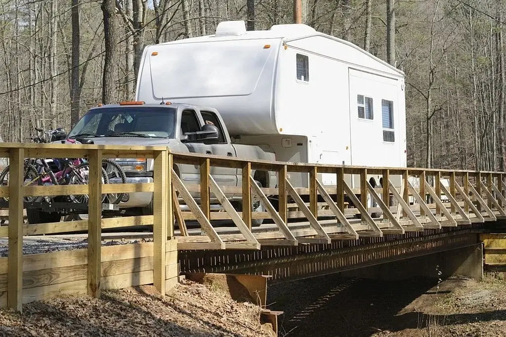 truck camper crossing a bridge