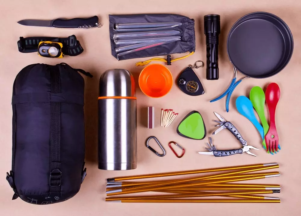 various camping gear to pack in a backpack