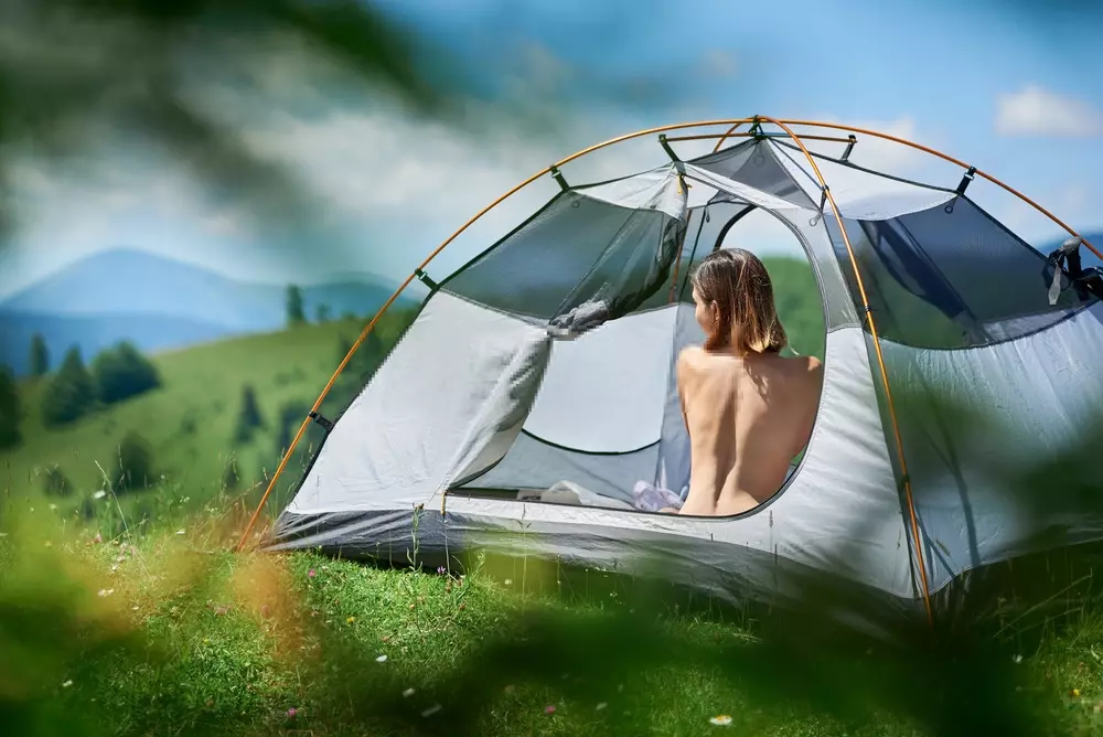 woman camping basking in the sun